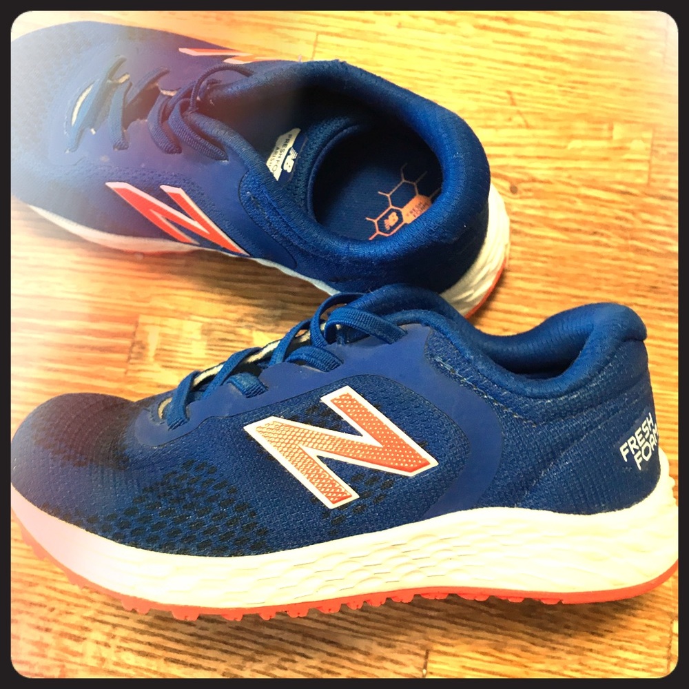 New Balance kids turf shoes.